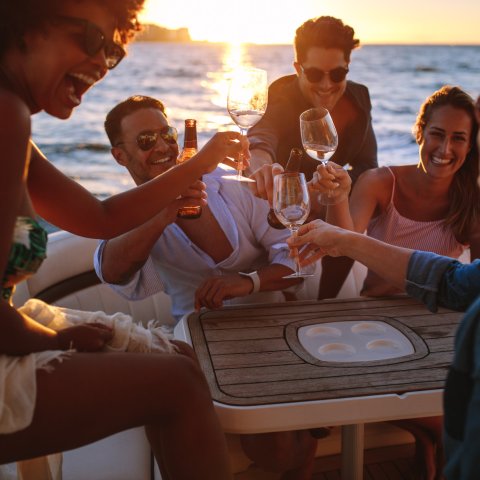 a group of people are drinking from the water