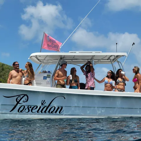 a group of people on a boat in the water