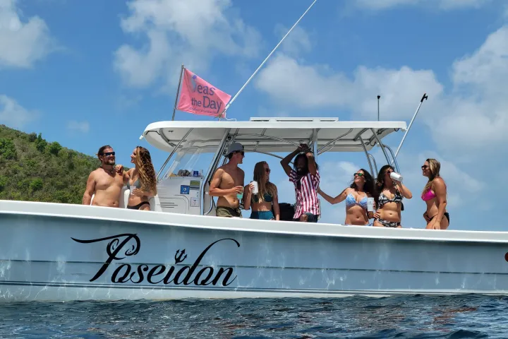 a group of people on a boat in the water