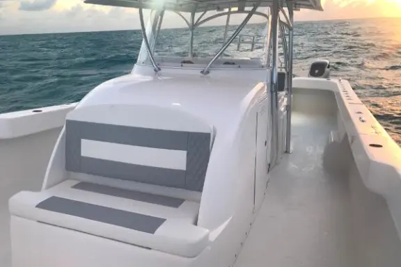 a boat sitting on top of a car