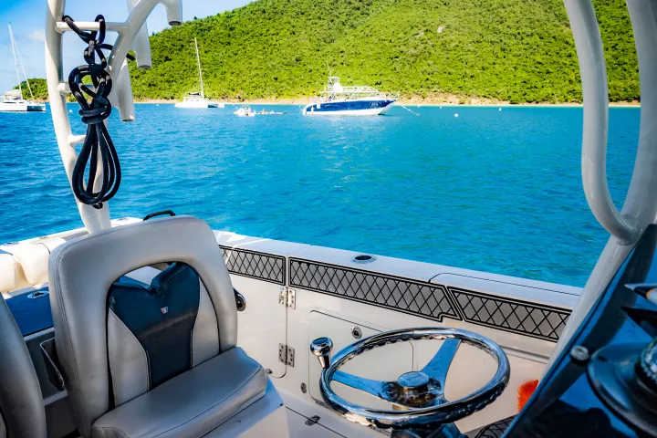 The helm and captains chair of Seas the Day Charters USVI M/V Aquarius