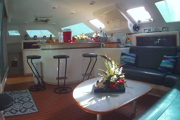 a living room filled with furniture and a large window