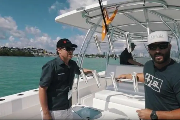 a man standing in front of a boat