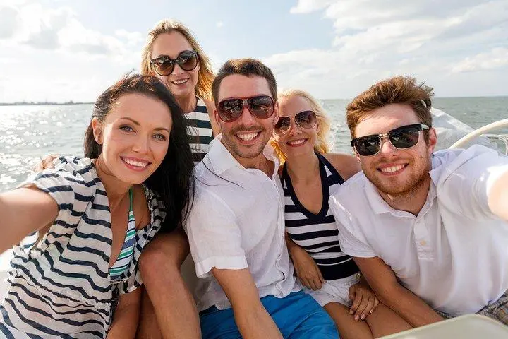 a group of people sitting posing for the camera