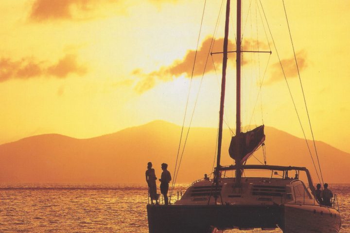 a group of people on a boat in the water