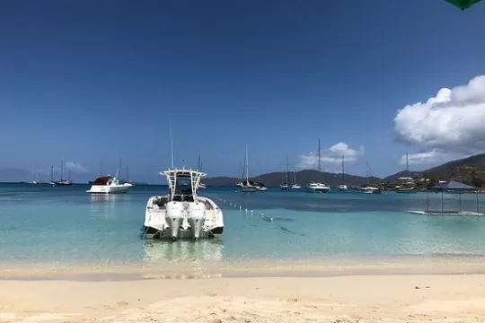a boat on a beach near a body of water