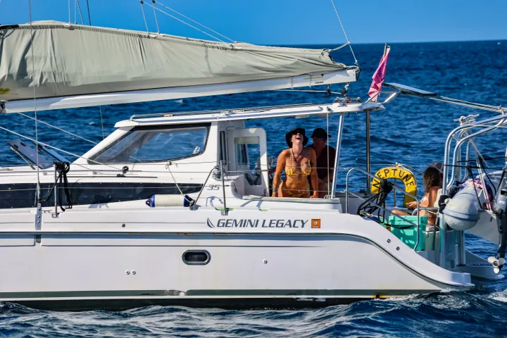 Guests relaxing at shaded aft seating on Seas the Day Charters USVI S/Y Neptune