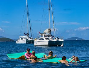 Seas the Day Charters USVI Party Yacht Sea Wolf guests hanging out on lily pad