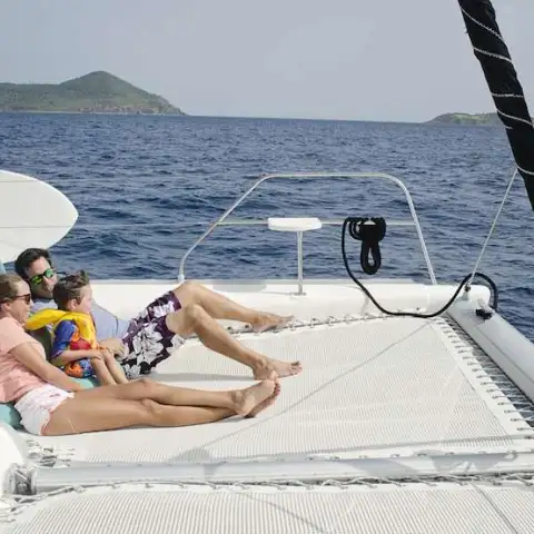 a couple of people that are sitting on a boat in the water