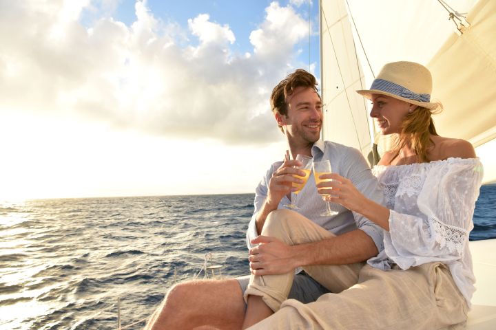 a man and a woman sitting at a beach