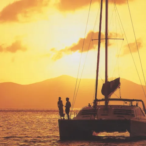 a group of people on a boat in the water