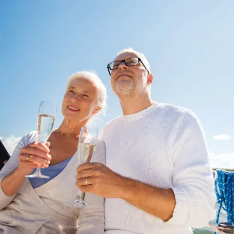 Joyce Rey holding a glass of wine