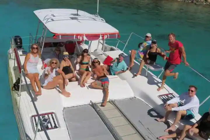 a group of people on a boat in the water