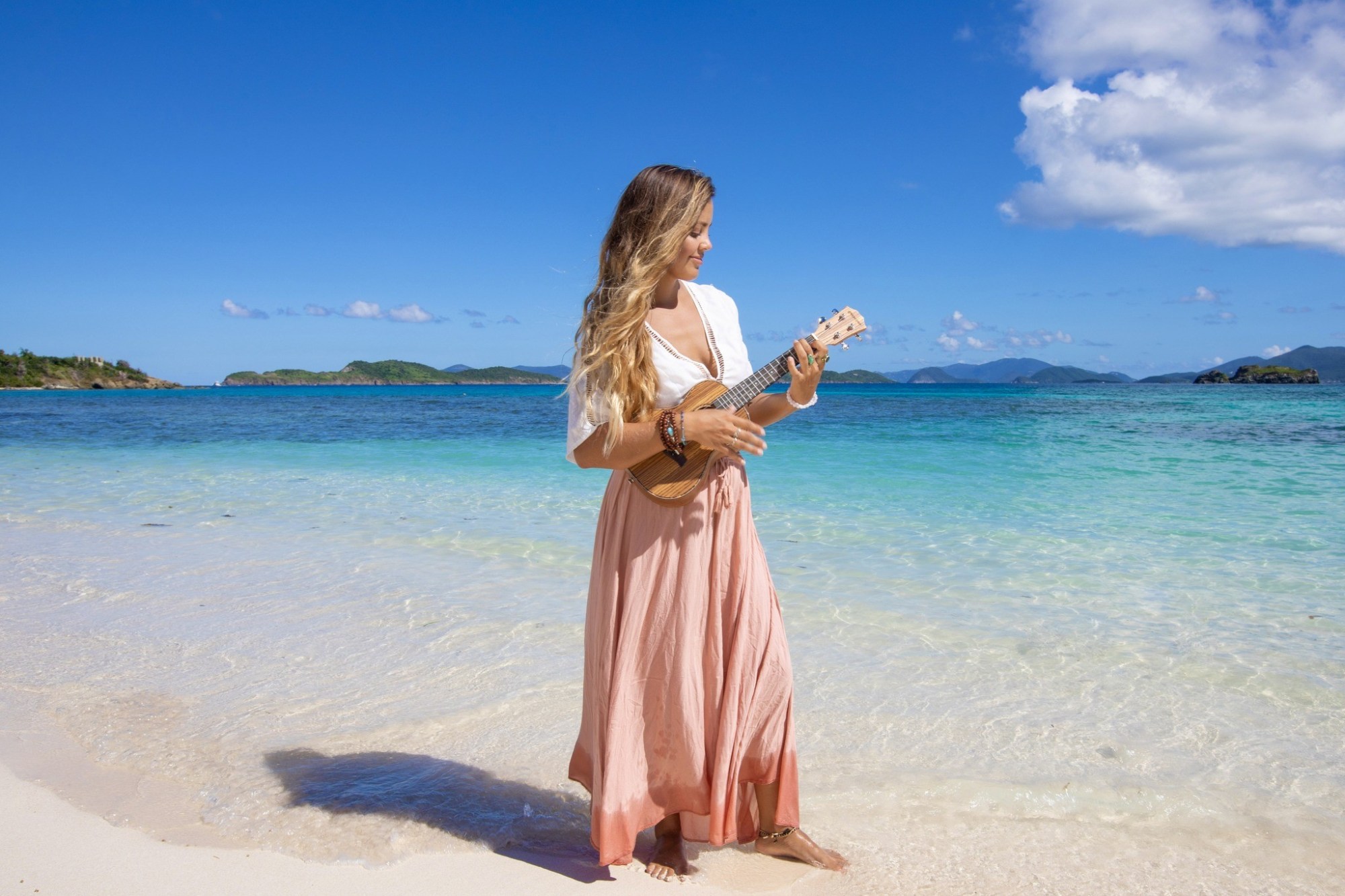 Cassandra 2 Local artist Cassandra playing music on the beach