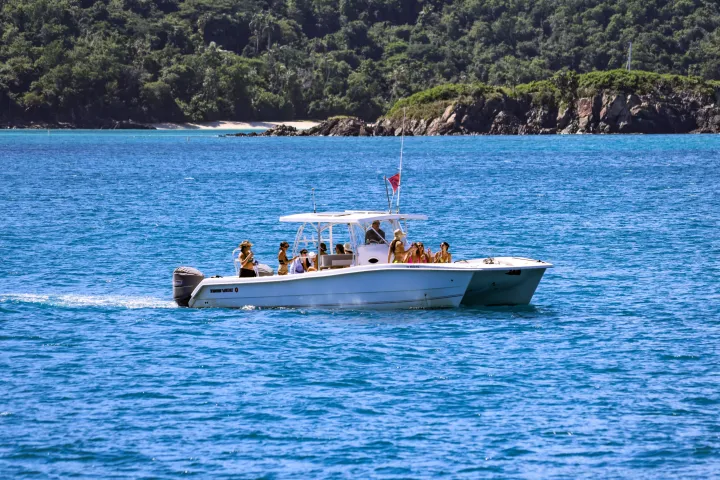Seas the Day Charters USVI TwinVee PowerCat M/V Poseidon arriving at Maho Bay St. John, USVI
