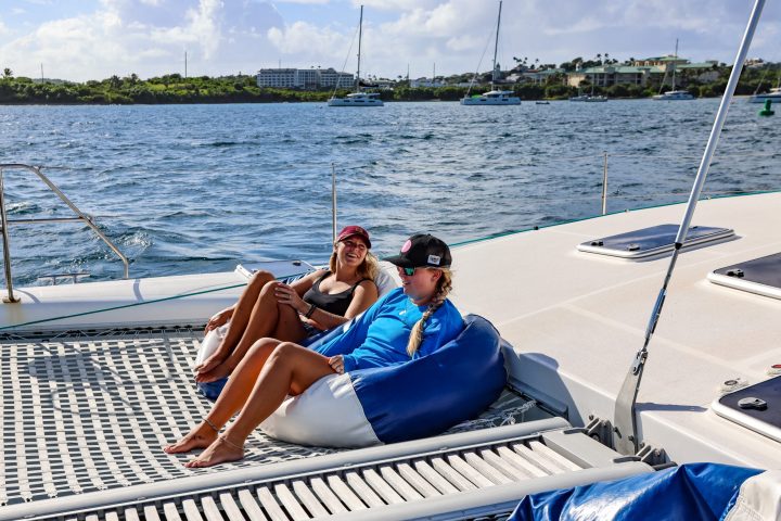 Two guests relaxing in bean bag chairs on Seas the Day Charters USVI S/Y Leviathan, a private yacht in St. Thomas USVI