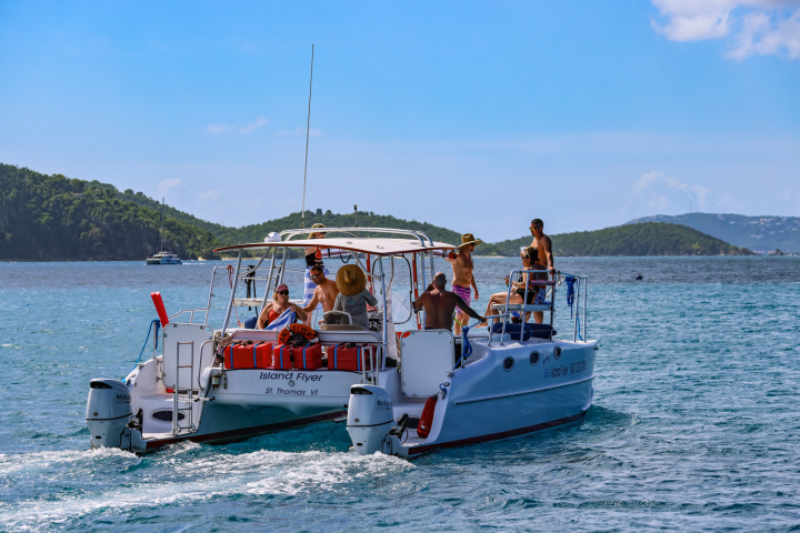 9 Seas the Day Charters USVI guests aboard M/V Island Flyer as the vessel departs for Maho Bay, St. John