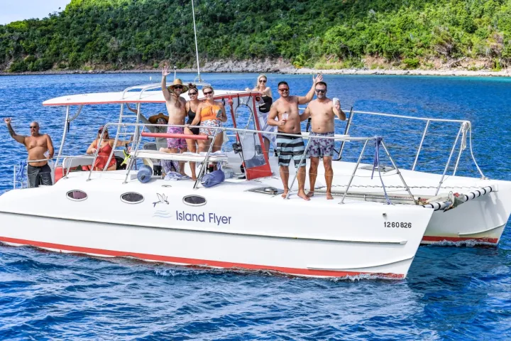 Guests aboard Seas the Day Charters USVI private charter boat M/V Island Flyer waving as they passed by