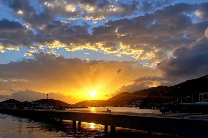 Sunset over St. Thomas USVI from Seas the Day Charters sailing catamaran