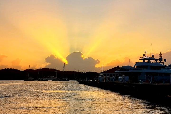 Sunset over St. Thomas USVI from Seas the Day Charters sailing catamaran